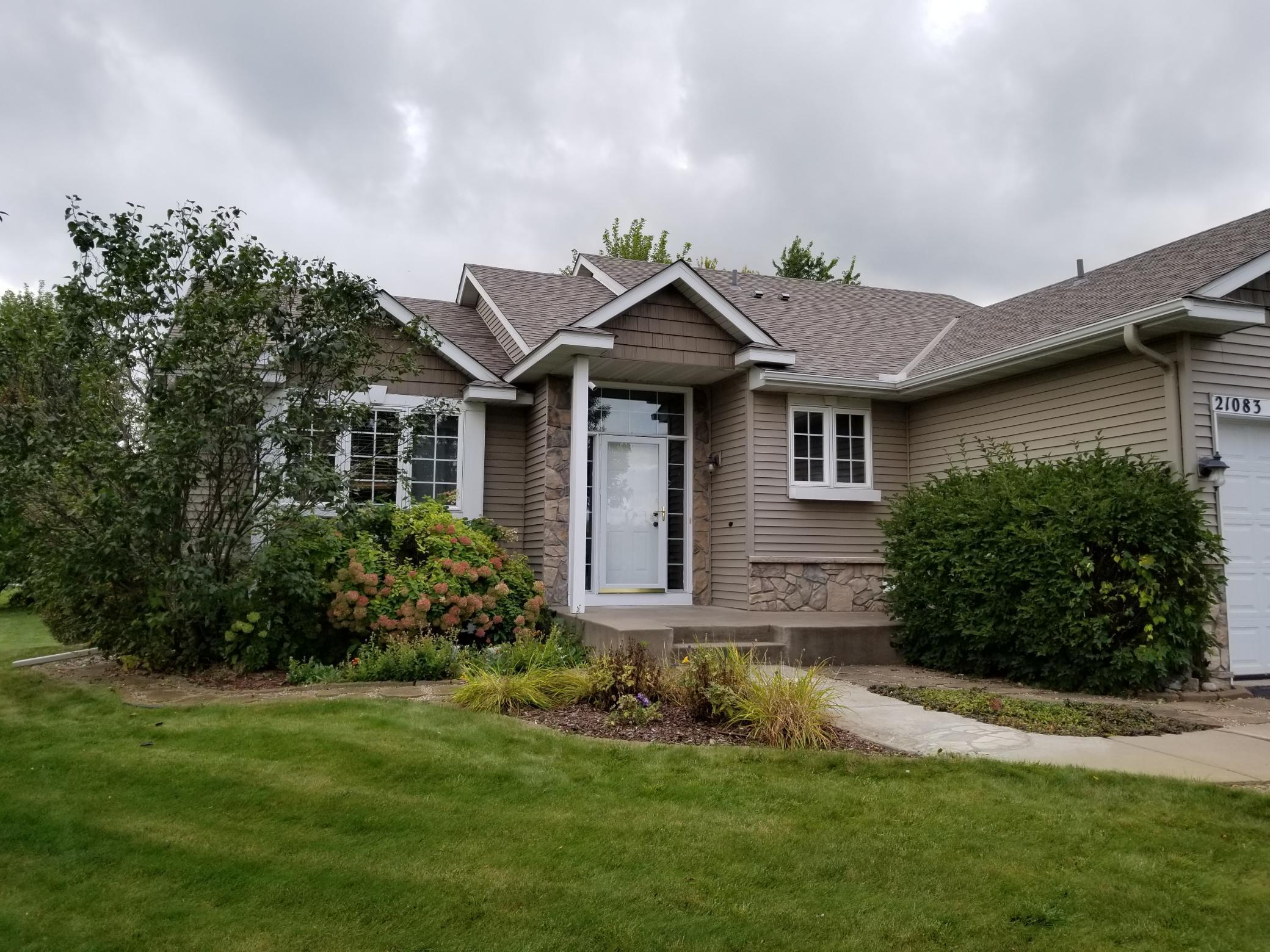 The well-maintained front yard landscaping during the warmer months.