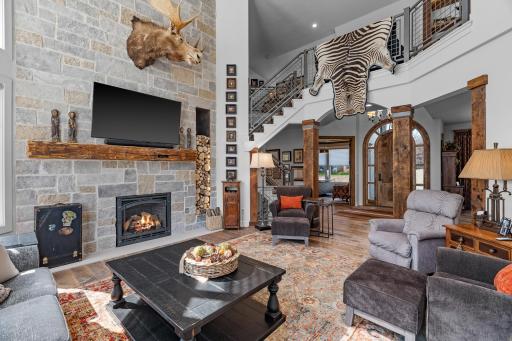 The two story "floor-to-ceiling" fireplace is warm and rustic.