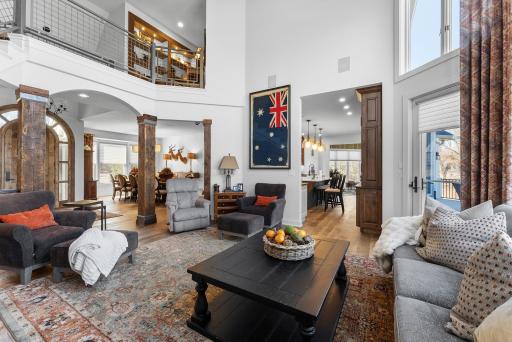 The great room feeds into the kitchen and the formal dining room.