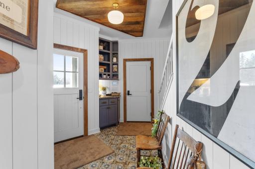 The service entrance leads to the garage, secondary staircase, laundry and the pantry.