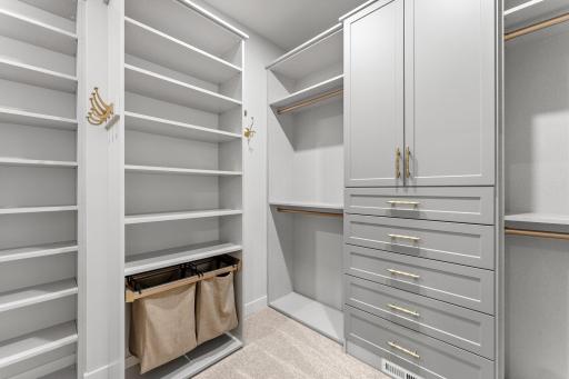 The primary bedroom with one of the two walk-in closets.