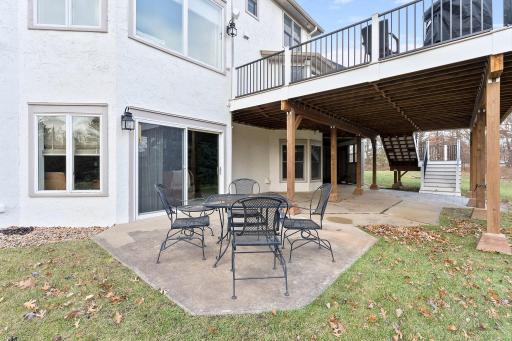 The rear yard patio opens up through sliding glass doors to the family room.
