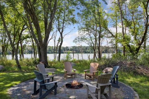 Inlaid stone fire pit overlooking the water
