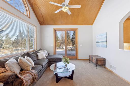 Stunning sun room with vaulted beadboard ceiling