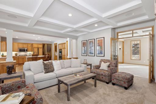 Coffered ceiling details continue into the great room.
