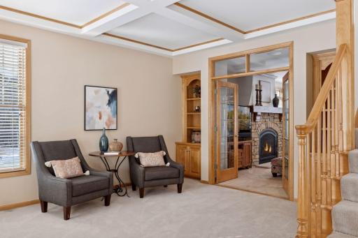 Coffered ceiling is featured in the front living room.