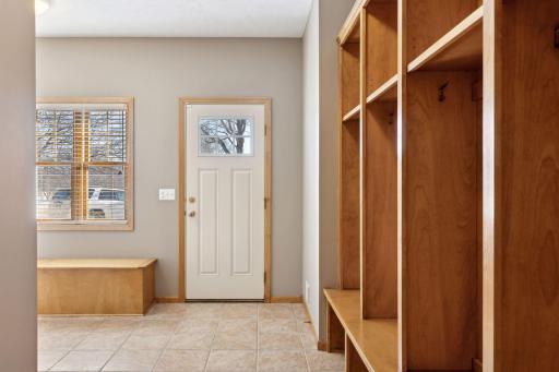 Deluxe mudroom right off the attached 3-car garage offers cubbies plus a huge walk in closet.