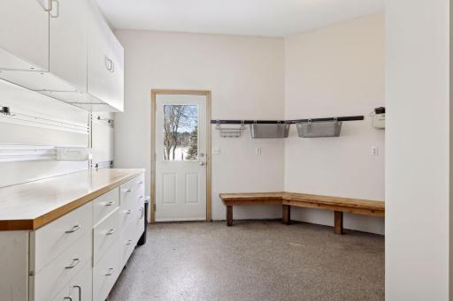 Workshop and storage space in your oversized 3-car garage with epoxy flooring.