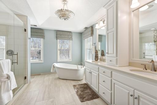 Recently remodeled primary ensuite with soaking tub and large walk-in shower.