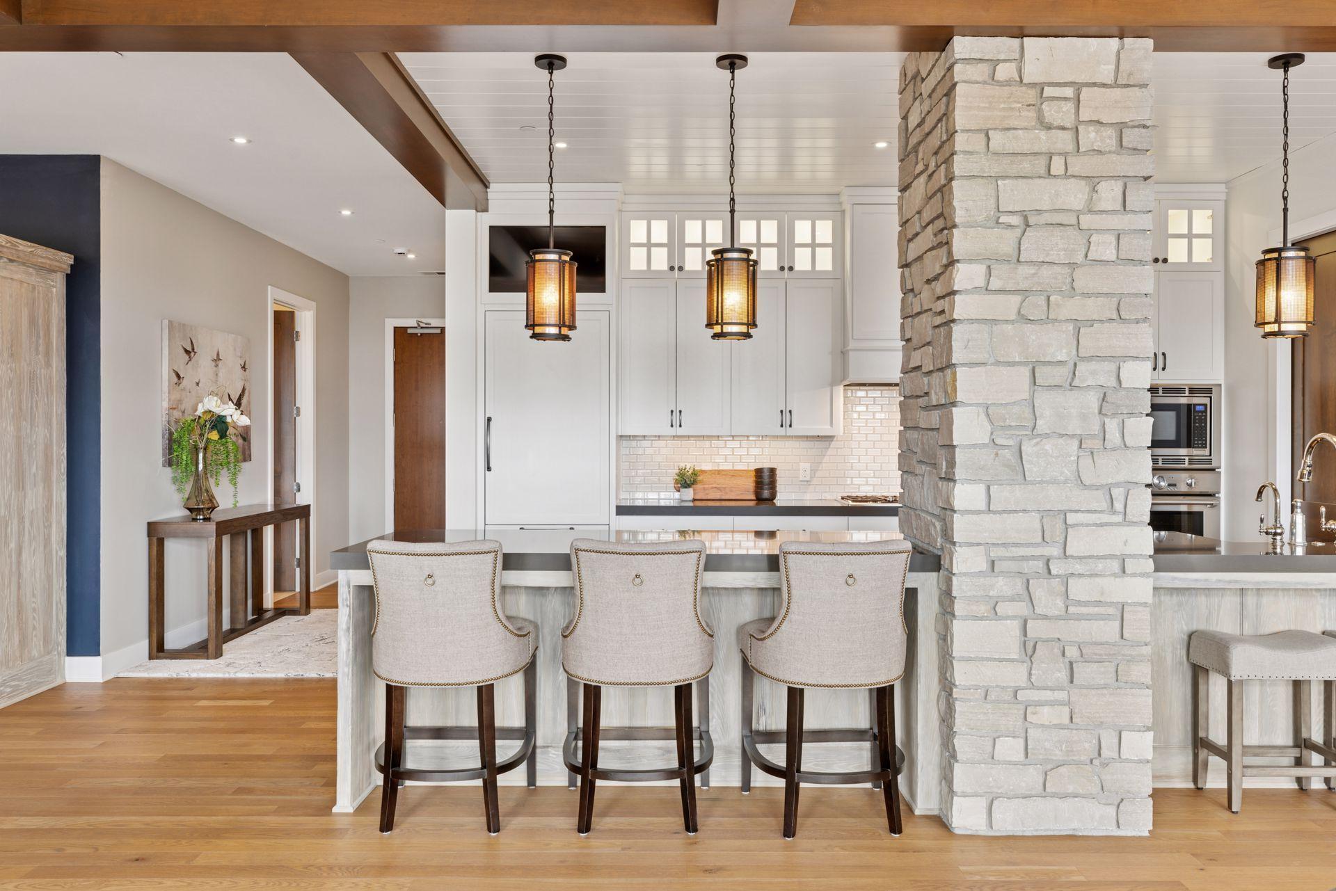 Stunning design elements include stone, wood, paint colors, textured built-ins, and creative lighting fixtures