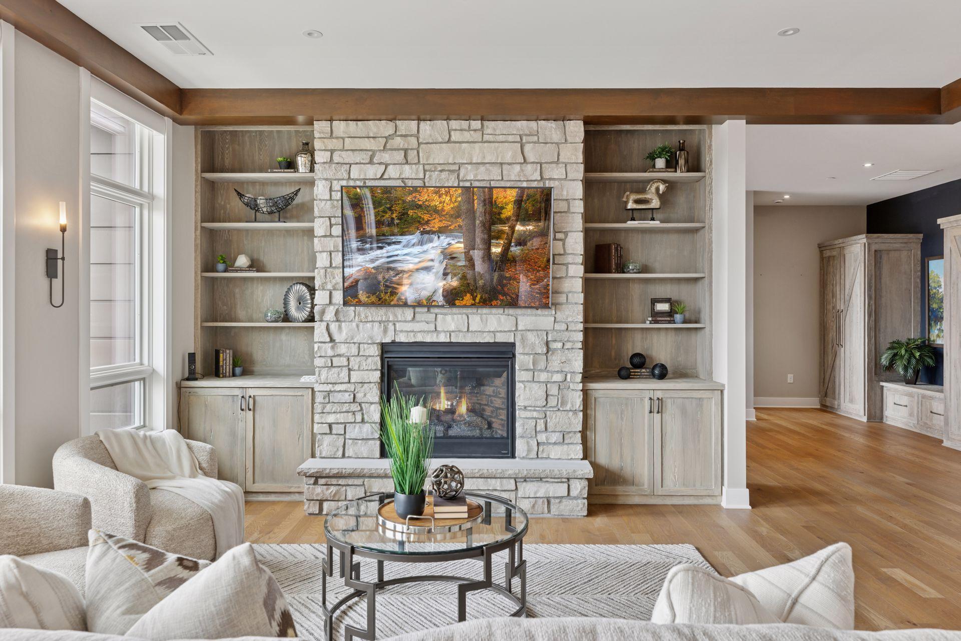 Highlights in the main areas include beautiful hardwood floors, stunning stone details, wood beams, and built-ins throughout the condo