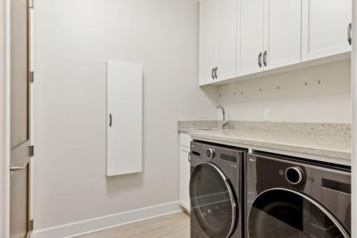 Spacious laundry room with storage