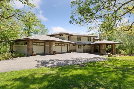 Special features include solar panels, a 2-story Sun Room with Hot Tub, Home Theater, heated RV/Boat garage & beautiful views of Black Lake!