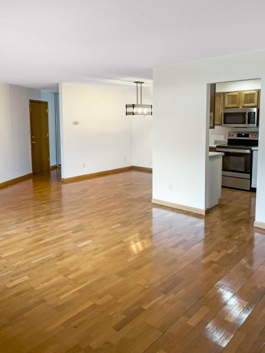 5440 Three Points Blvd -view of front door/dining/kitchen from living room