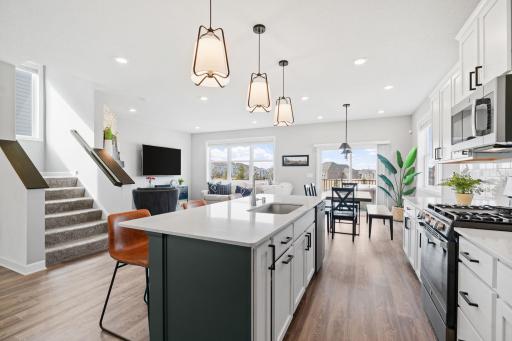 Kitchen island with updated pendant lighting.