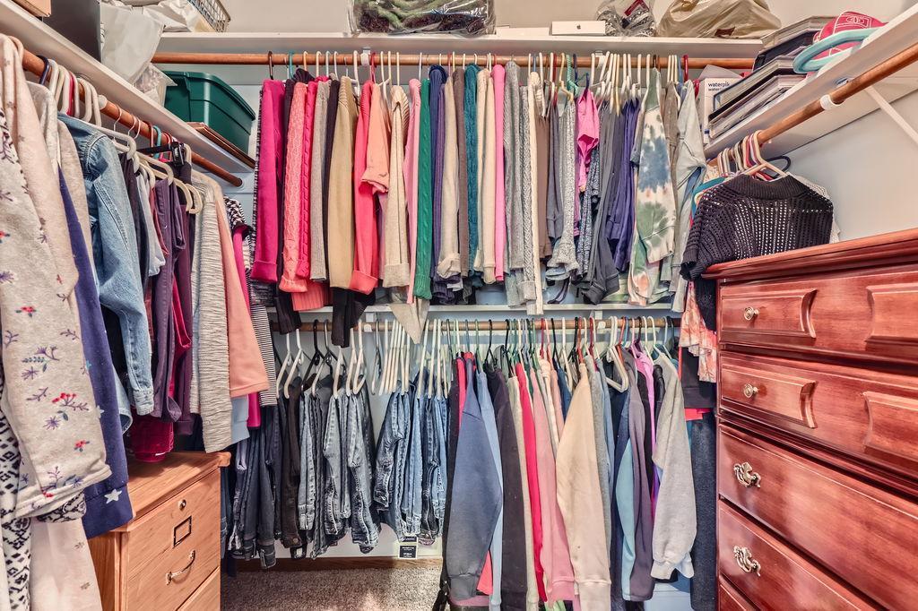 Primary bedroom walk in closet