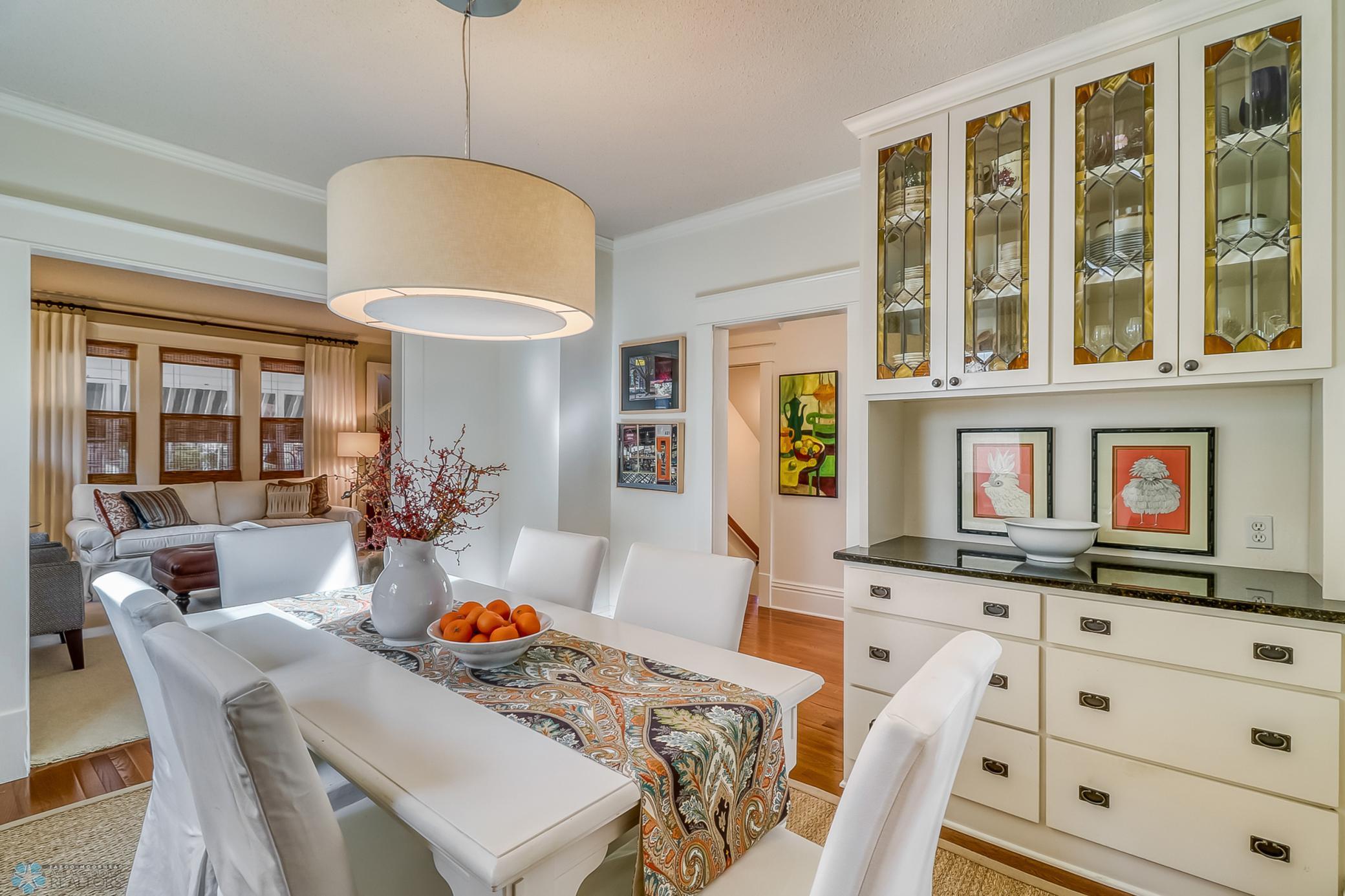 Dining Room with Built-in Hutch With Leaded Windows