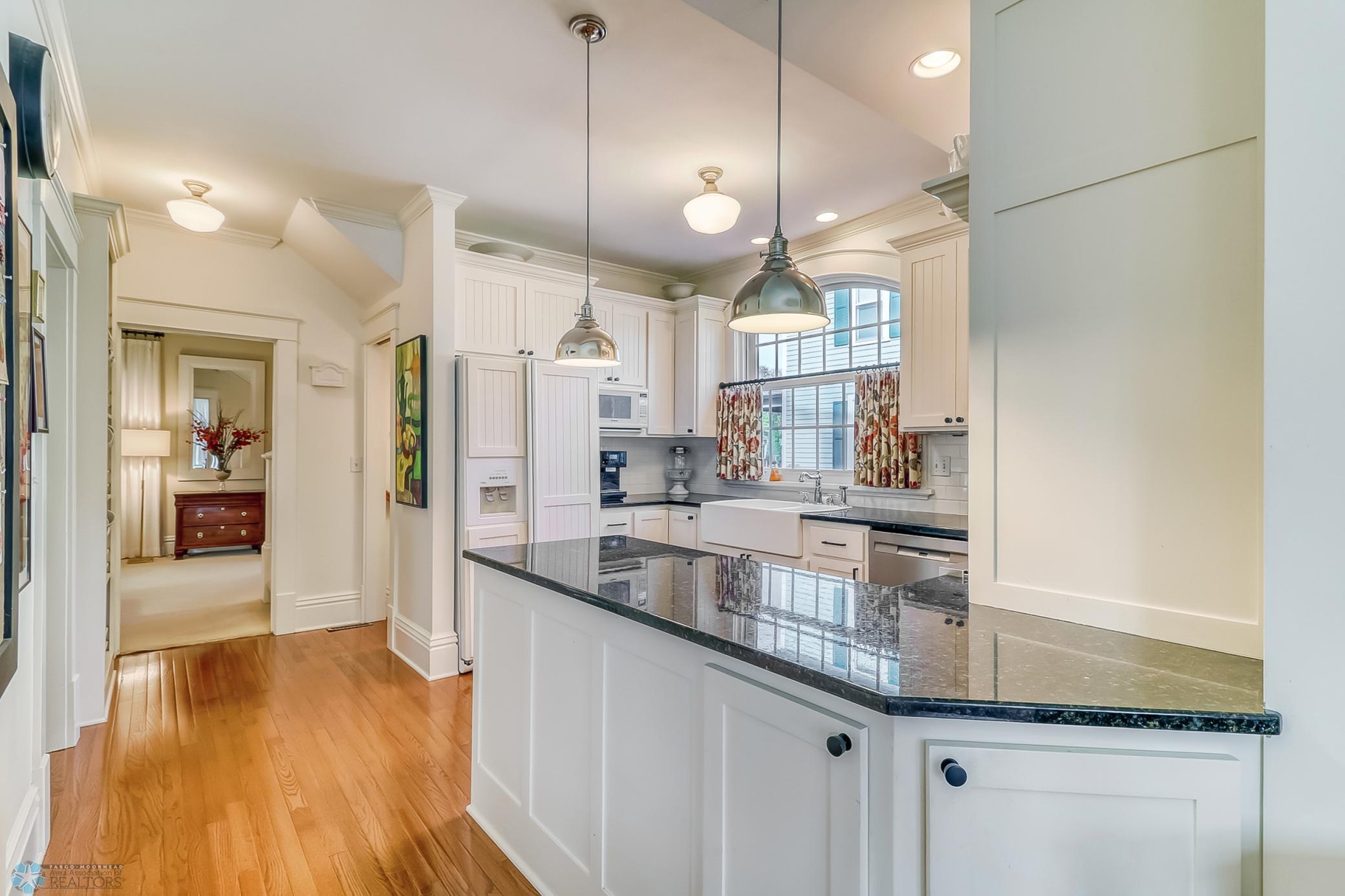 Kitchen Bar Opens into Family Room Addition