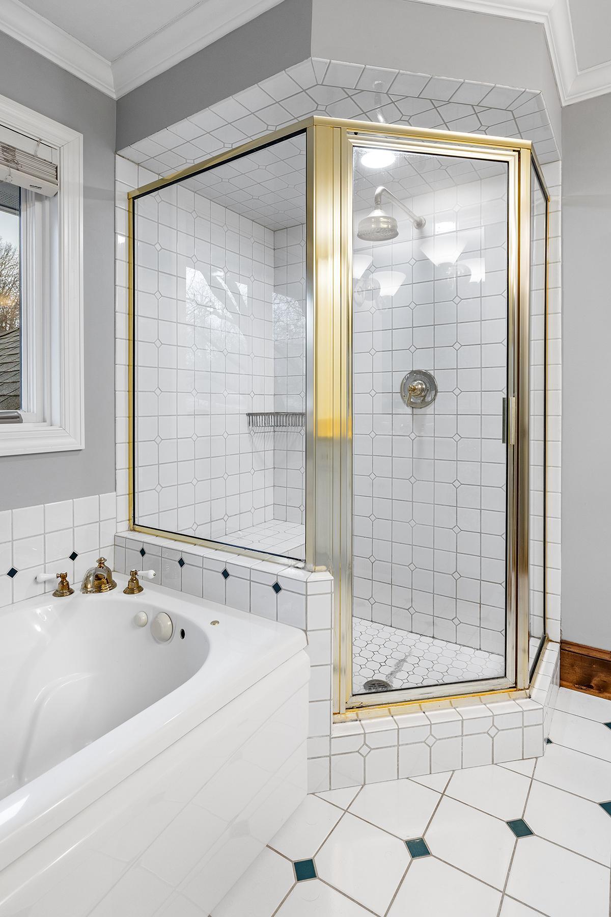 Full bath with tub and walk-in shower.