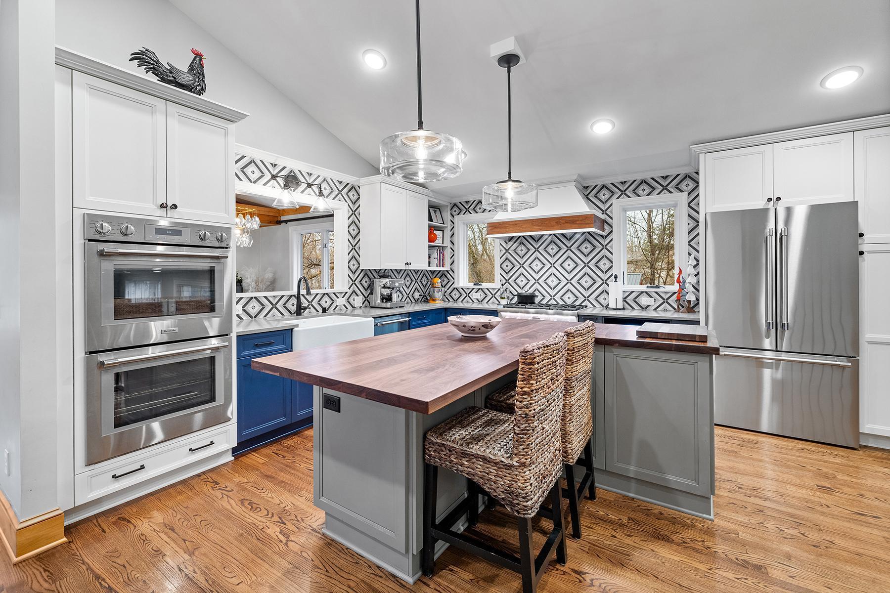 Enjoy oversized breakfast bar, double ovens, and stainless steel Thermador appliances.