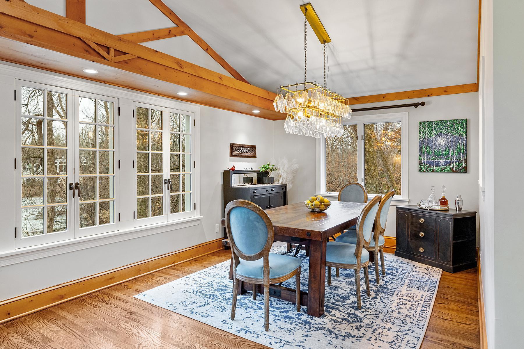 Beautiful natural wood floors, beams, and windows letting in southern light.