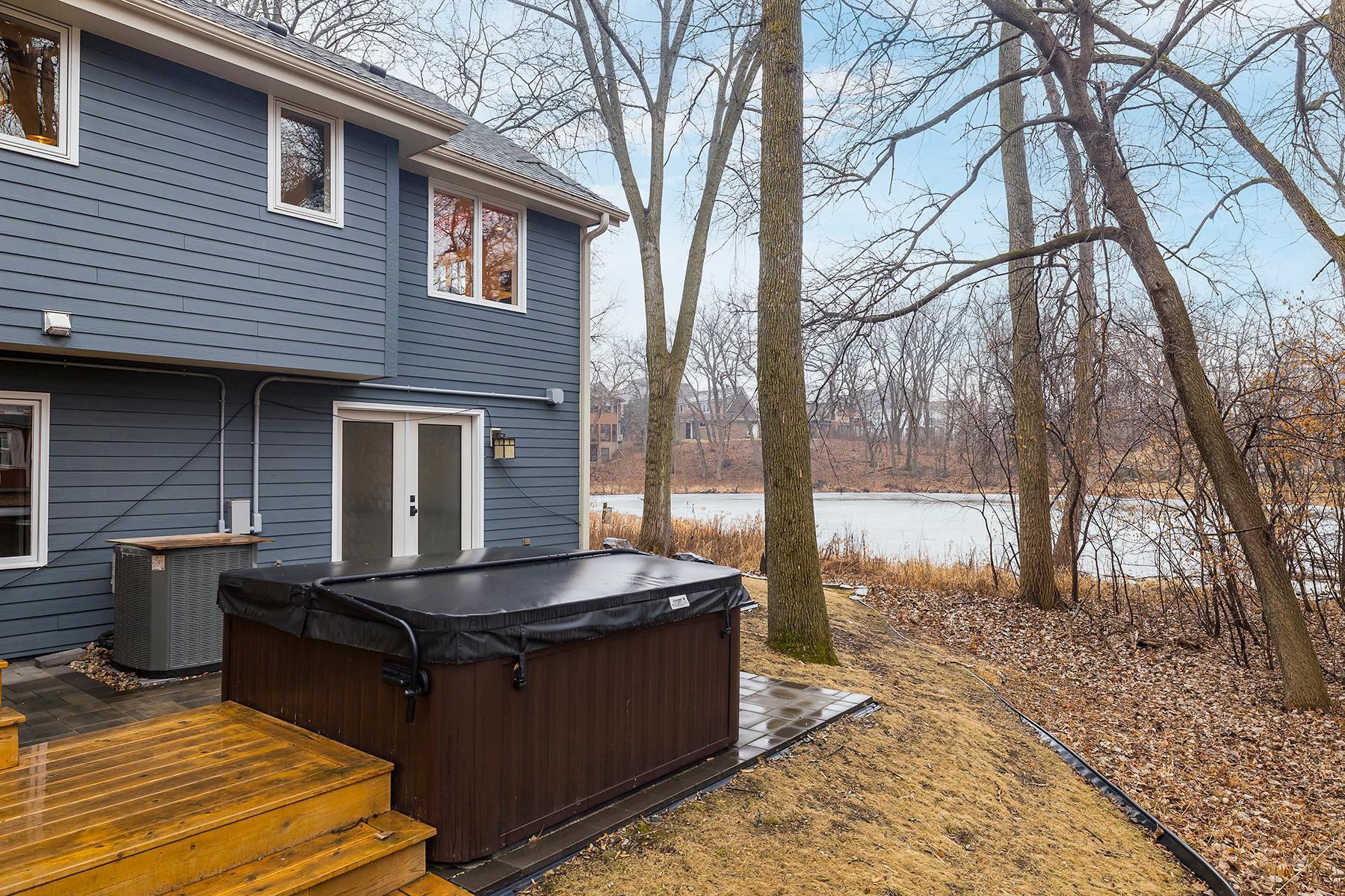Newer decking, back patio and hot tub.