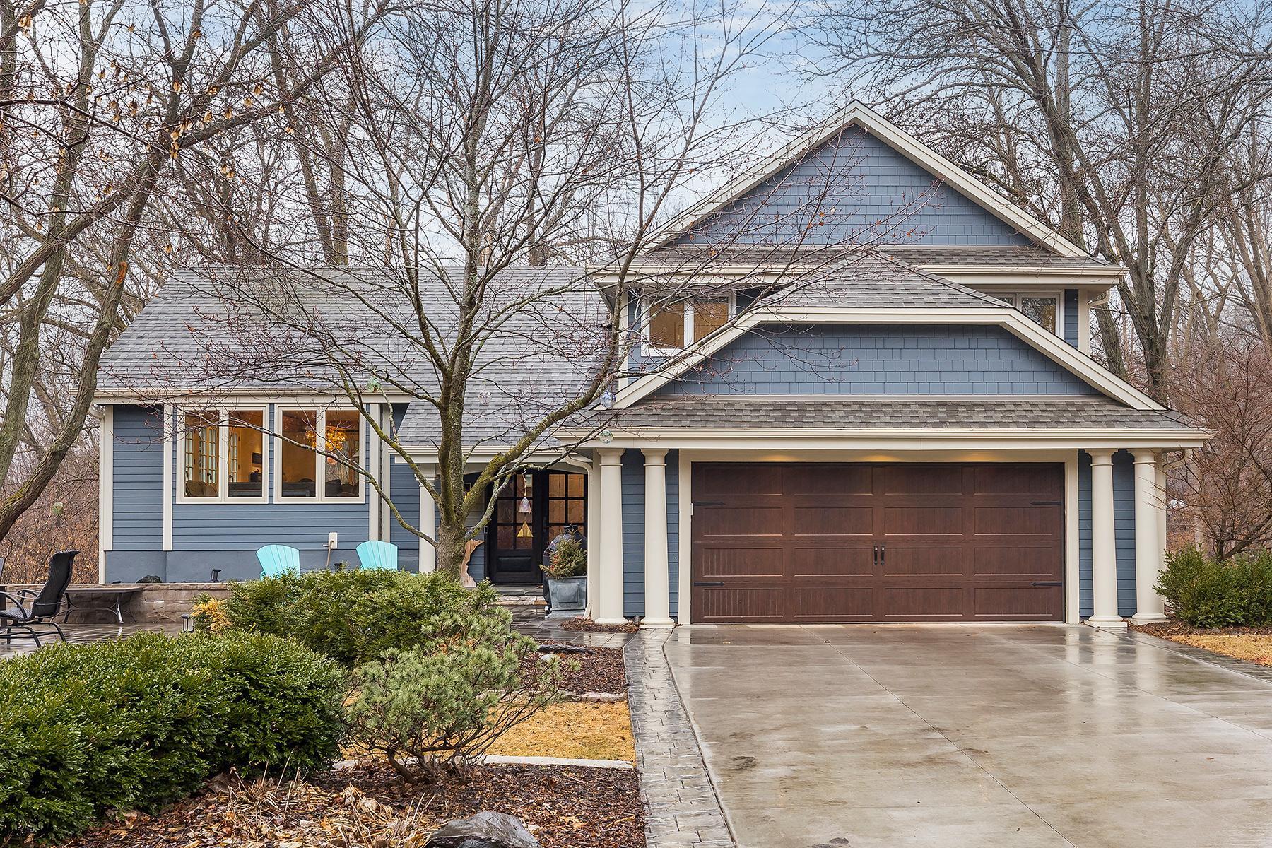 Newer siding, concrete driveway, and garage door.