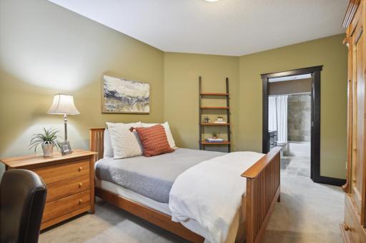 Lower level fifth bedroom ensuite complete with private full bath