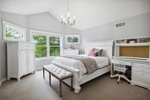 Bedroom 3 showcases a vaulted ceiling, walk-in closet and shared full bath and separate walk-thru closet