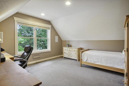 Bedroom 4 is set off the bonus room with walk-in closet