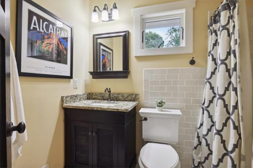 Upper level, 3/4 hallway bath features subway tile shower surround