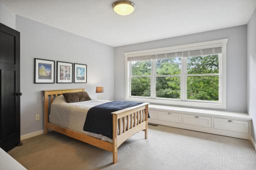 Bedroom 2 features a walk-in closet, full wall of windows with window seat