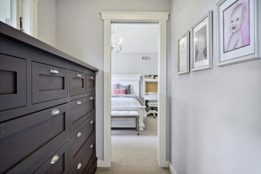 Unique walk-thru closet with chest of drawers is also located between bedrooms 2 and 3