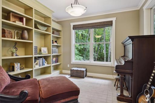 Set at the back of the home, the study features a wall of built-in bookcases and is framed in for French doors if desired by the new owners. Doorway is framed to accommodate a door if desired.