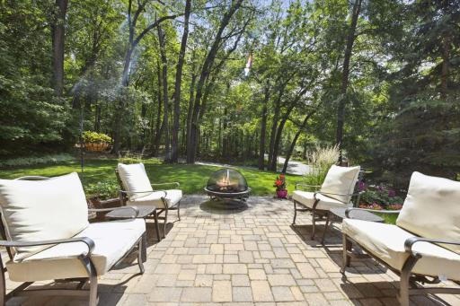 Lots of room to run & play in the level backyard with private wooded views.