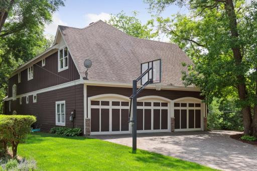Large, level paver drive with end-load, oversized 3-stall garage (R/I for heater) and basketball hoop