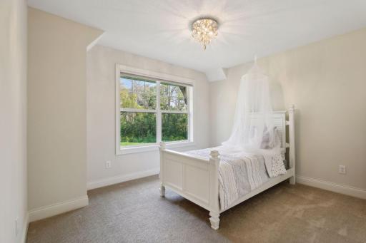 One of four bedrooms located on the Upper Level