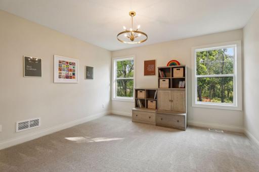 One of four bedrooms located on the Upper Level