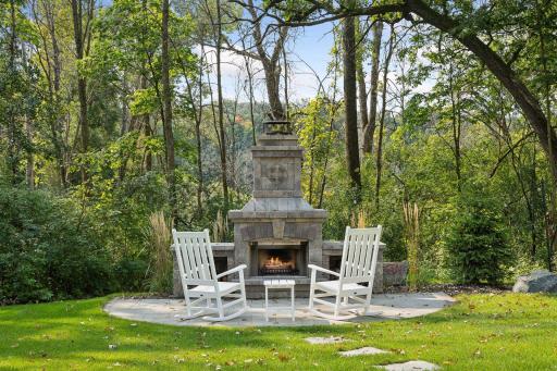 Grand Outdoor Fireplace with Patio seating