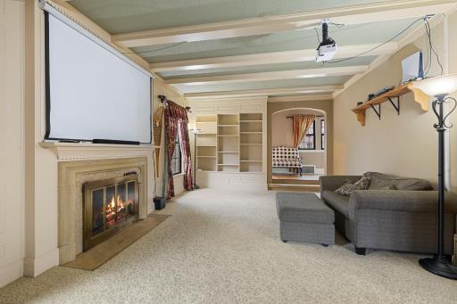 Cozy fireplace with high-end antique stone surround.