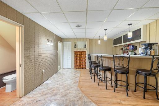 Full wet bar in lower level with half bath