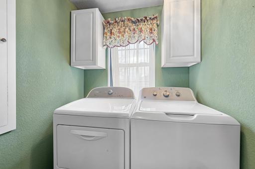 Upper level laundry near beds/bath with fold-out ironing board/drying rack.