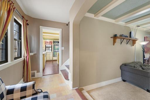 Entry corridor to living, upper level, and kitchen.