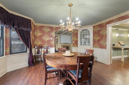 Classic chandelier and built-in dining storage.