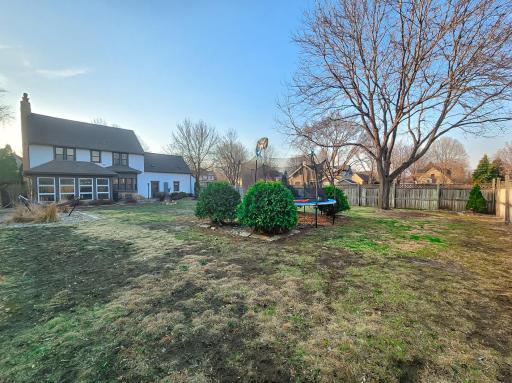 3/4 privacy fenced with tree line for additional privacy