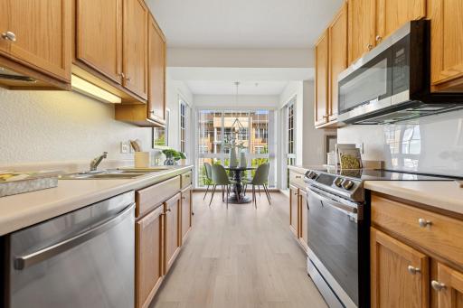 Updated & timeless luxury vinyl plank flooring in the kitchen & entry!