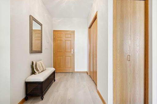 Functional front door entry with convenient closet.