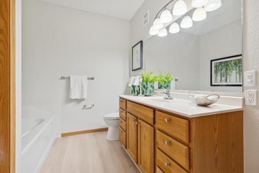 Primary bath also updated w/ luxury plank flooring.