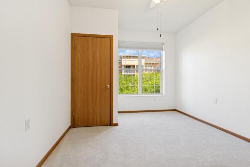 Sizeable 2nd bedroom w/ new, power operated room darkening shades.