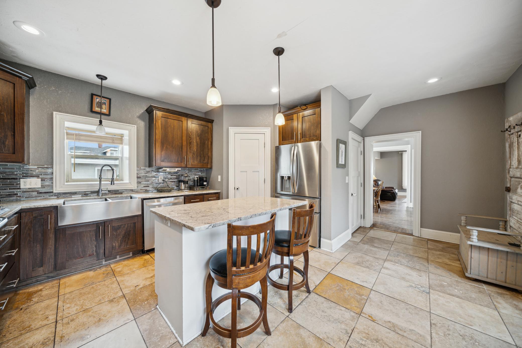 A Country SS sink, walk in pantry, beautiful cupboards with plenty of countertop space! You will love cooking your meals here!